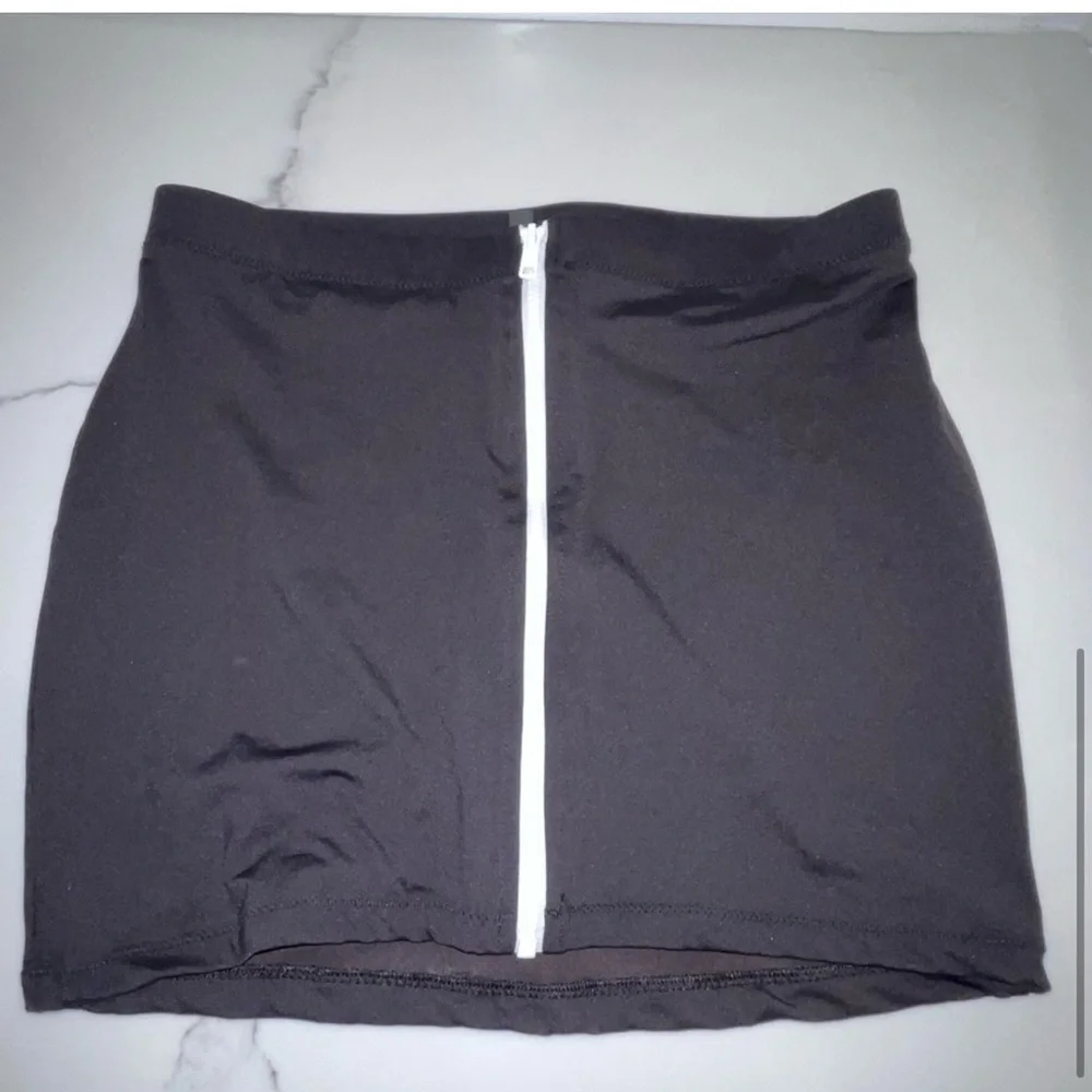 SKIMS sporty zipper swim mini skirt black p1.